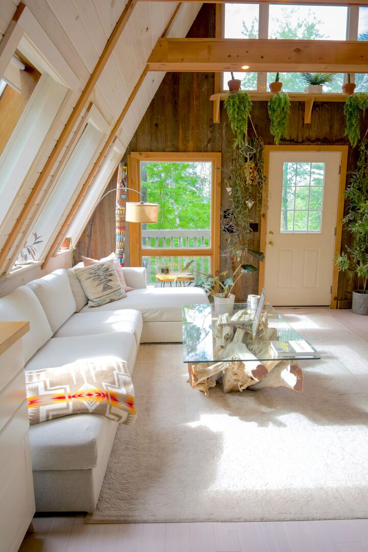 Light and bright a-frame cabin living room, modern boho rustic living room design, boho living room design