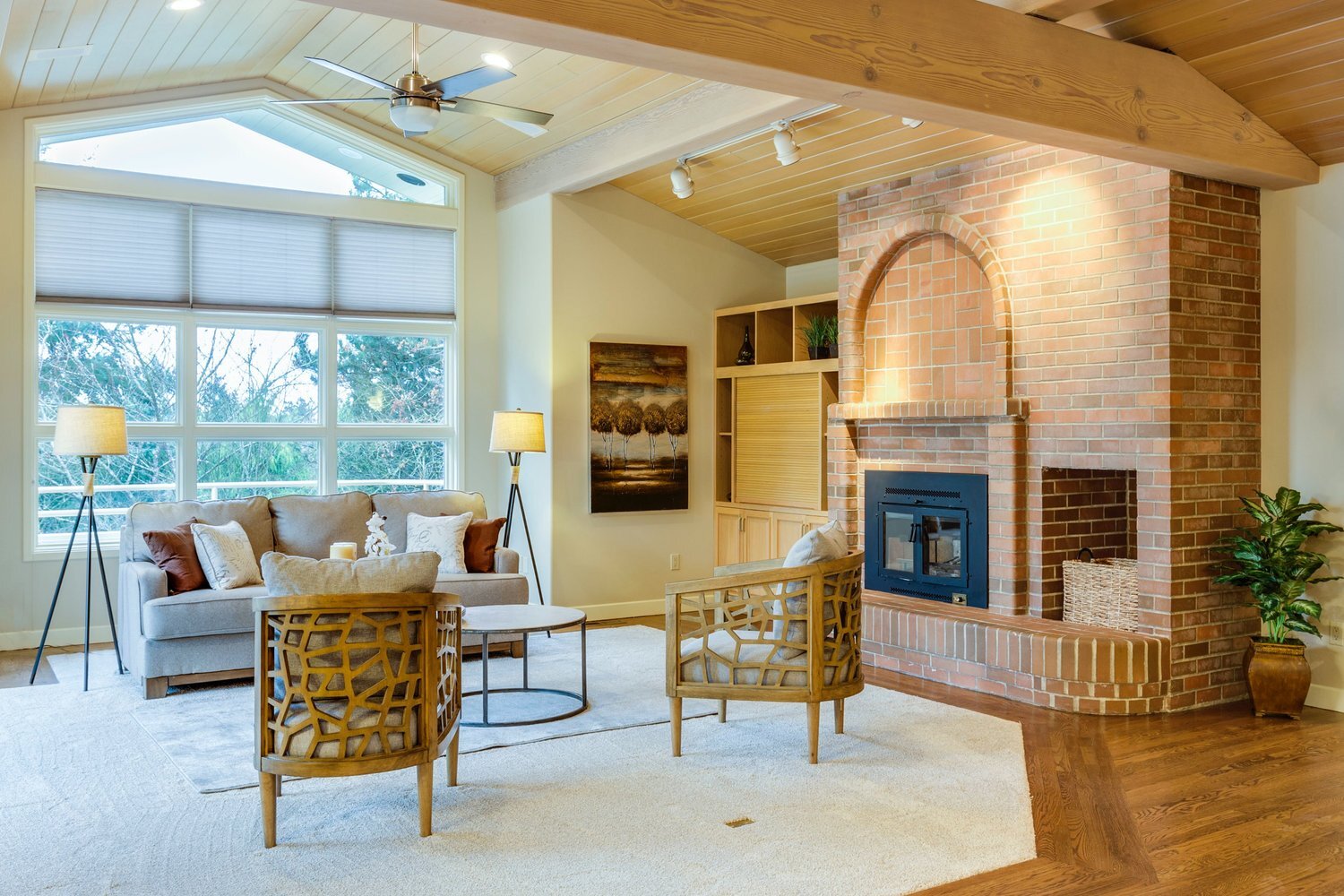 Rustic open concept living space with exposed brick