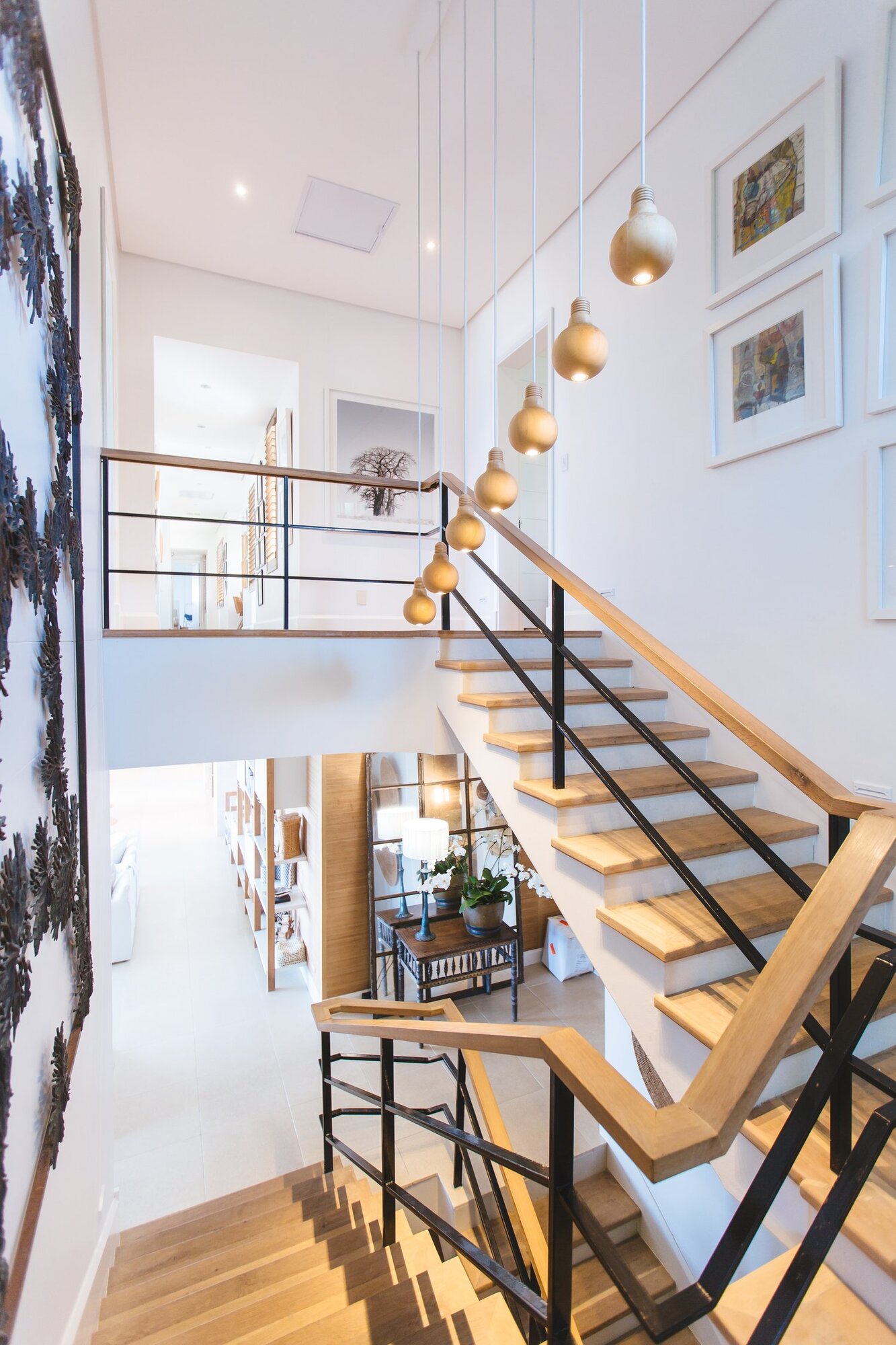 Large open staircase with modern wood and metal rails