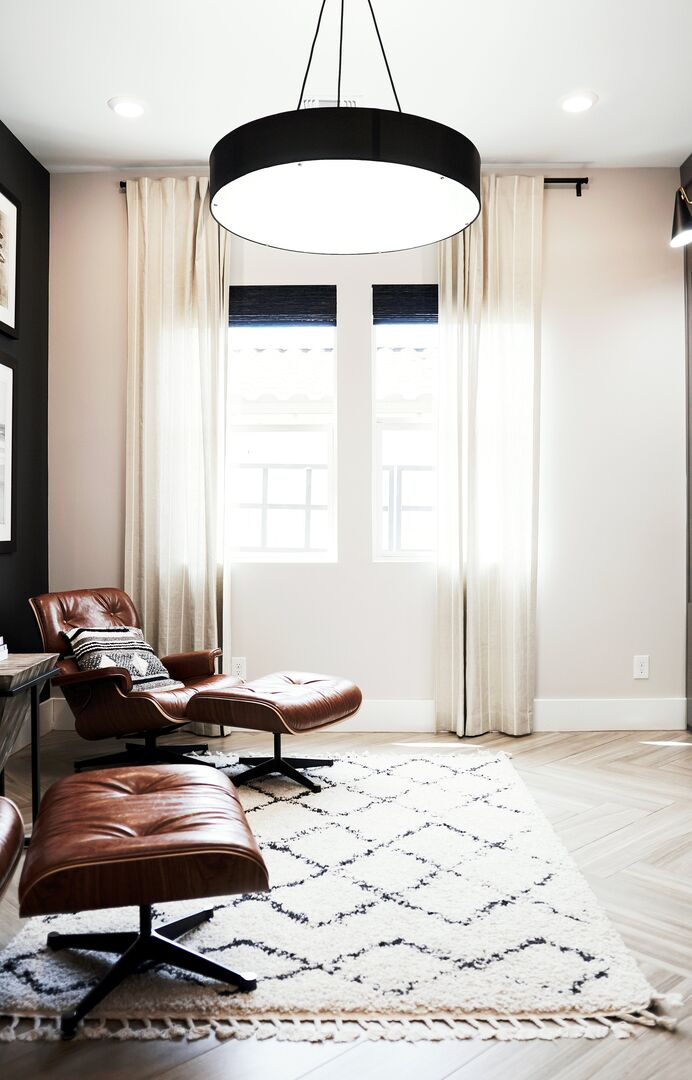 Leather chair and ottoman in den