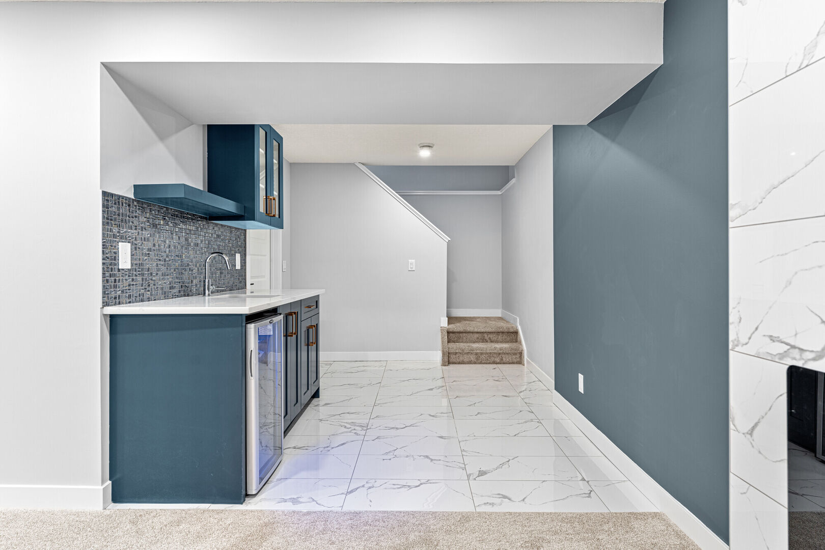 modern basement renovation with blue accents and wet bar, Calgary house flip design